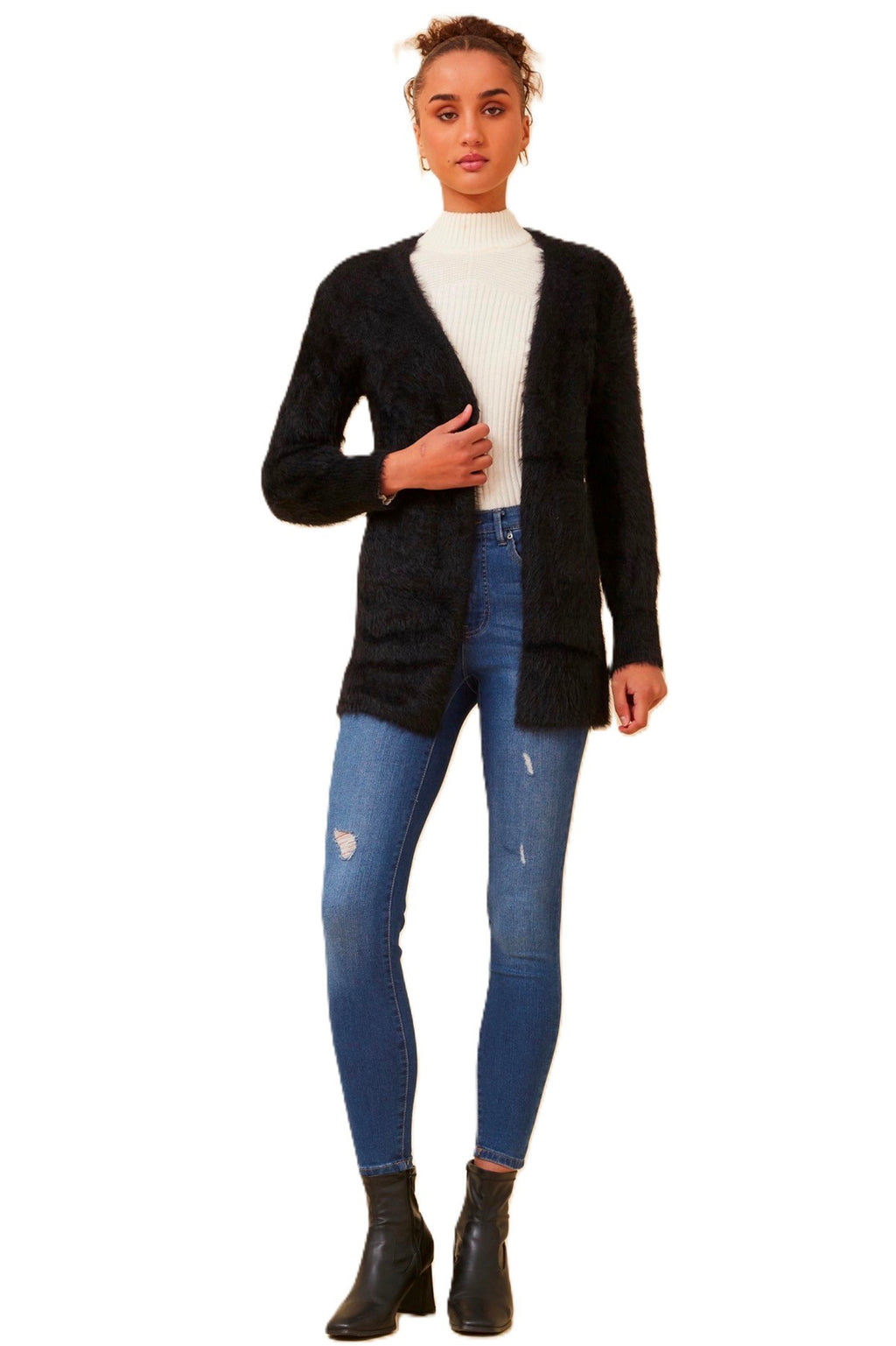 The Leeza Cardigan in Black effortlessly combines comfort and style with its soft eyelash yarn and is ideal for easy transeasonal styling. Pair it with your favorite jeans and a basic tee for a trendy day look, or belt it over a dress for an effortless transition from day to night. Cleveland Markets It's All About You Boutique Brisbane Fashion