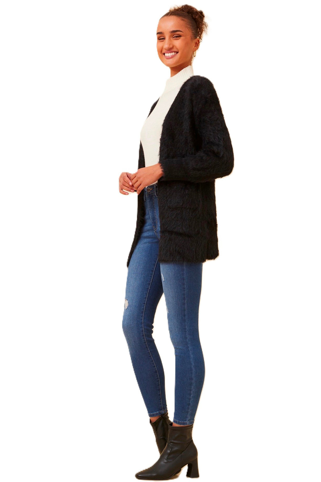 The Leeza Cardigan in Black effortlessly combines comfort and style with its soft eyelash yarn and is ideal for easy transeasonal styling. Pair it with your favorite jeans and a basic tee for a trendy day look, or belt it over a dress for an effortless transition from day to night. Cleveland Markets It's All About You Boutique Brisbane Fashion