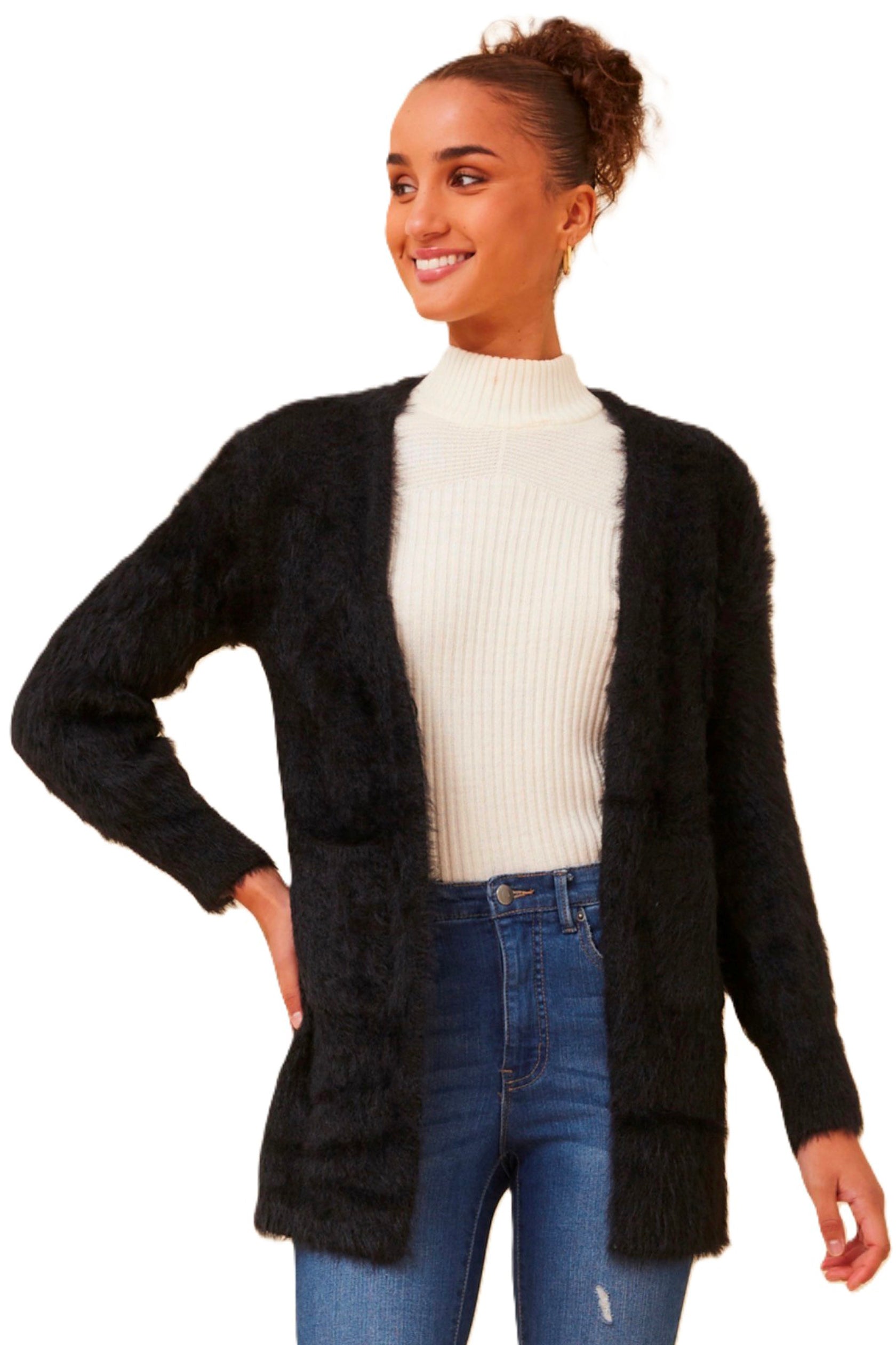 The Leeza Cardigan in Black effortlessly combines comfort and style with its soft eyelash yarn and is ideal for easy transeasonal styling. Pair it with your favorite jeans and a basic tee for a trendy day look, or belt it over a dress for an effortless transition from day to night. Cleveland Markets It's All About You Boutique Brisbane Fashion